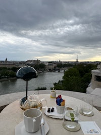 a table with a view of the eiffel tower